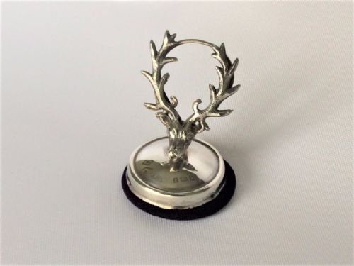 fig 1. An unusual stag's head silver card/menu holder.