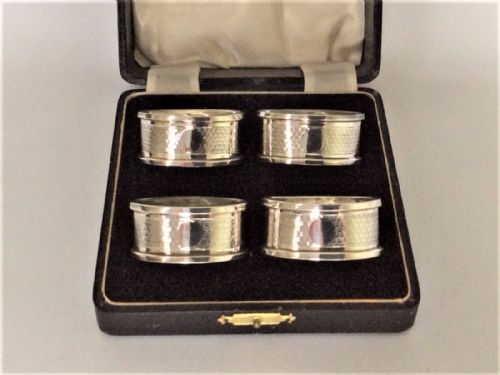 An Art Deco Set of Boxed Silver Napkin Rings.