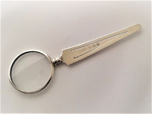 A Novelty Silver Spyglass and Bookmark Combination.