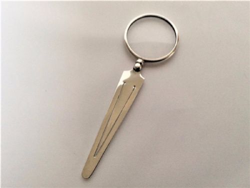 fig 1. A novelty silver spyglass and bookmark combination.