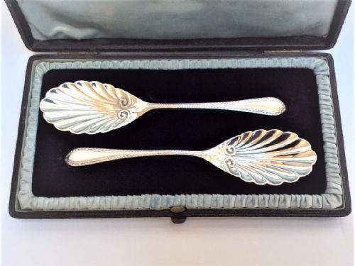 A Pair of Victorian Silver Boxed Jam and Marmalade Spoons.