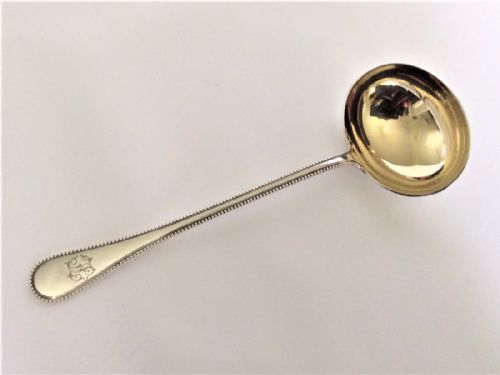A Handsome German Silver Gilt Gravy Ladle.