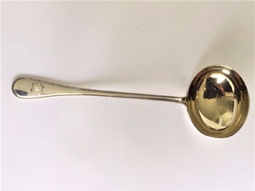 fig 1. A handsome German silver gilt gravy ladle.