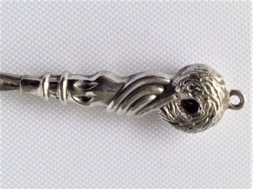 fig 1. A rare Edwardian swan head silver ribbon threader.
