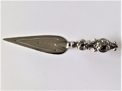 A Charming Silver Trowel Bookmark.