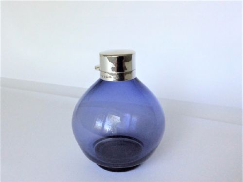 A Stunning Silver Mounted Asprey's Cologne Bottle.
