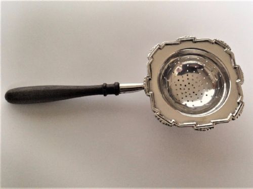A Stylish Art Deco Silver Tea Strainer.