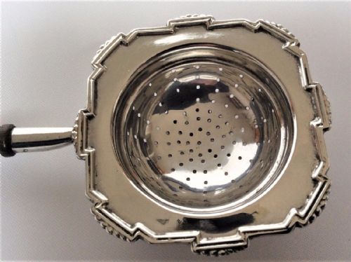 fig 1. A stylish Art Deco silver tea strainer.