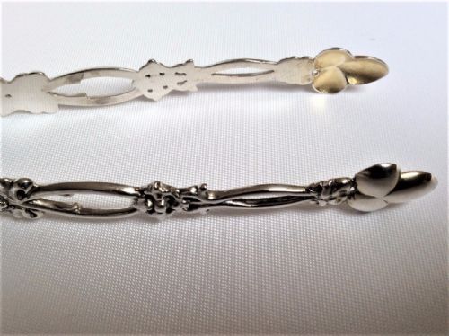 fig 1. A lovely pair of pierced Victorian silver tongs.