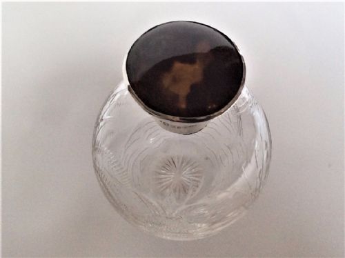 fig 1. An Aesthetic movement silver & tortoiseshell cologne bottle.