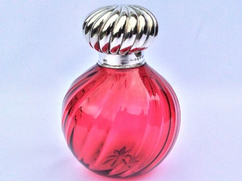 A Fabulous Victorian Silver Mounted Cranberry Cologne Bottle.