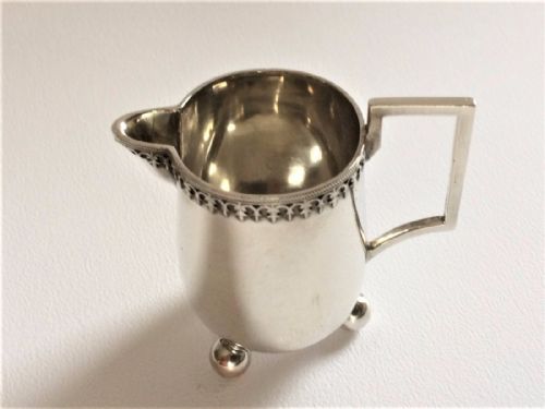 A Tiny One Serving German Silver Cream Jug.