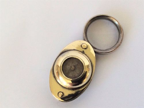 A Brass Compass & Magnifying Travelers Duo.