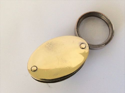 fig 1. A Brass compass & magnifying travelers duo.