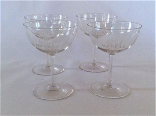 A Stylish Set of Four Engraved Champagne Glasses.