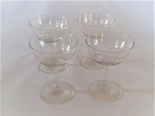 fig 1. A stylish set of four engraved champagne glasses.