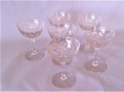 A Set of Six Victorian Cut Champagne Glasses.