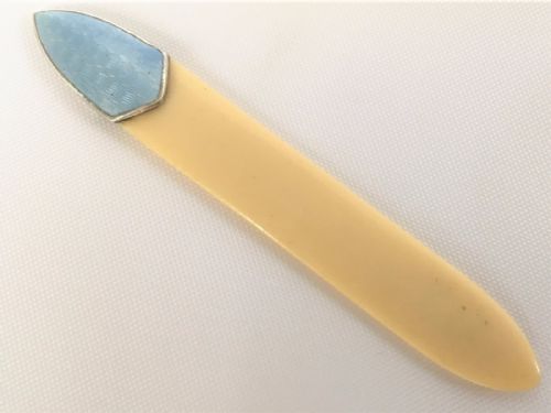A Silver and Enamel Ivory Bookmark.
