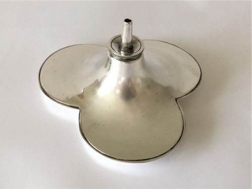 fig 1. An unusual silver trefoil table lighter.
