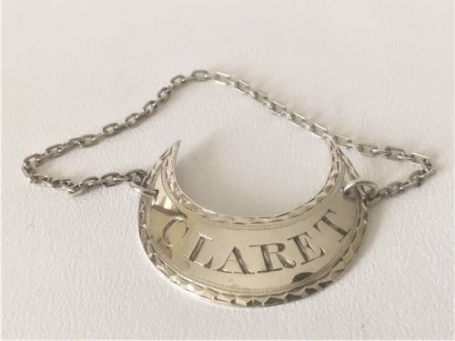 An 18th Century Sheffield Silver Claret Label.