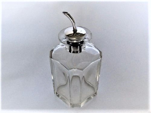 fig 1. A handsome Angostura silver mounted jiggers bottle.