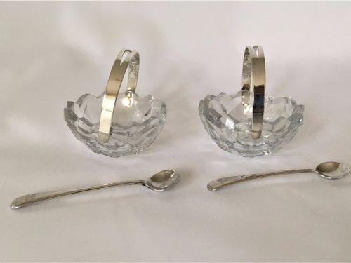 A Pair of Cut Glass Condiment Baskets with Silver Spoons.