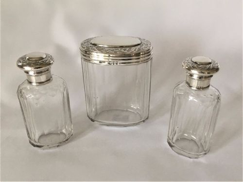 A Set of Three Victorian Silver Mounted Dressing Table Jars.