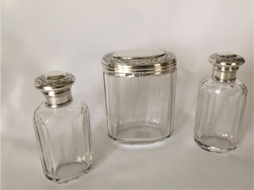 fig 1. A set of three Victorian silver mounted dressing table jars.