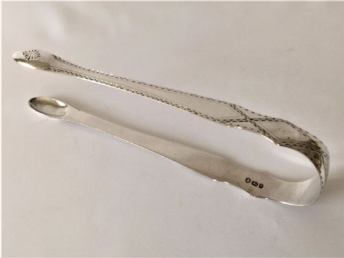 A Gorgeous Pair of 18th Century Silver Tongs.