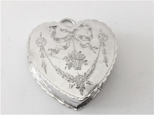 An Engraved Silver Heart Shaped Pillbox.