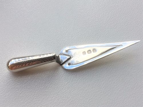 A Charming Bright Cut Silver Trowel Bookmark.