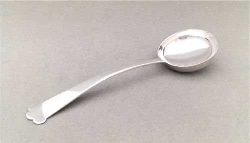 An Arts & Crafts Style Silver Cream/sauce Ladle