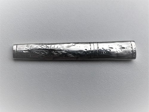 fig 1. A Georgian bright cut silver needle case
