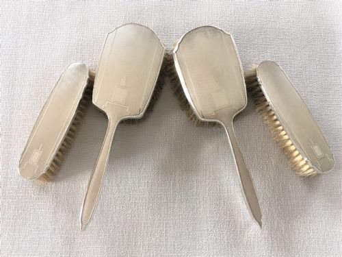 A Set of Four Art Deco Silver Brushes