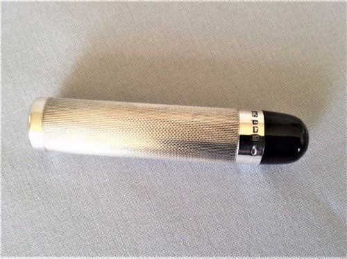 fig 1. An Art Deco silver theatre programme torch