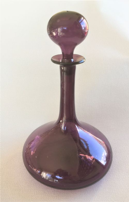 A 19th Century Amethyst Globe and Shaft Decanter