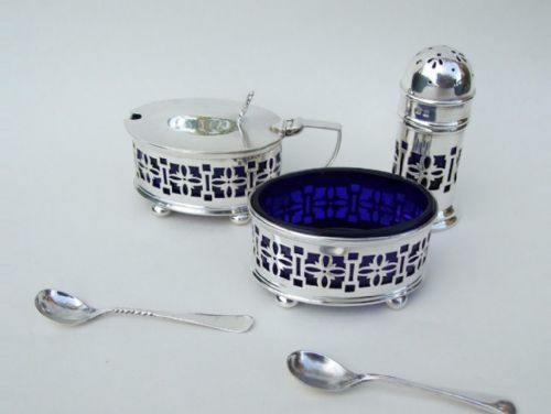 fig 1. A pierced silver three piece cruet