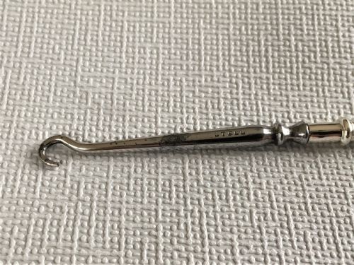 fig 1. A rare silver golf club button hook