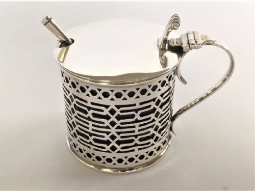 fig 1. A pierced silver drum mustard pot & spoon