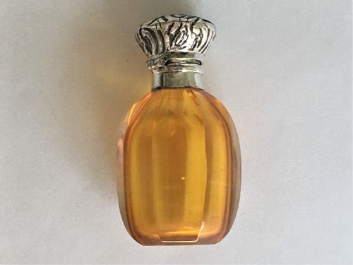 A Charming Silver Mounted Amber Scent Bottle