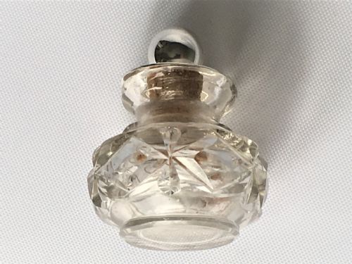 fig 1. A pretty silver mounted cut glass scent bottle