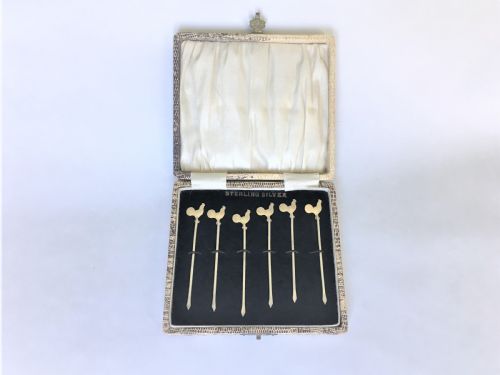 fig 1. A set of silver gilt cockerel cocktail sticks
