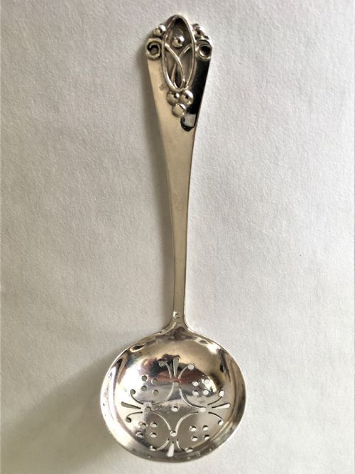 A Northwich Arts & Crafts Silver Sifter Spoon