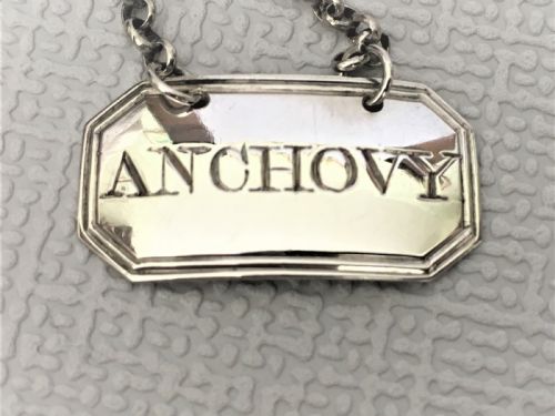 fig 1. An 18th Century silver 'anchovy' label