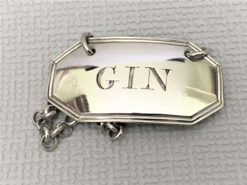 fig 1. A rare Georgian silver Gin label. Female Silversmith