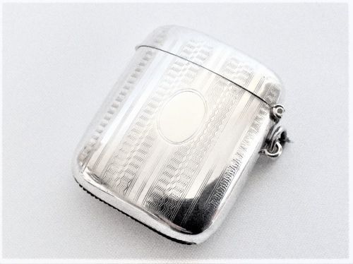 fig 1. A large engine turned silver vesta