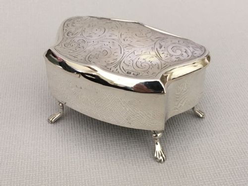A Shaped Silver Trinket Box with Engraved Decoration