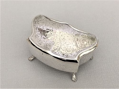 fig 1. A shaped silver trinket box with engraved decoration
