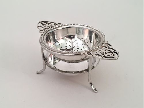 A Charming Silver Tea Strainer & Drip Cup