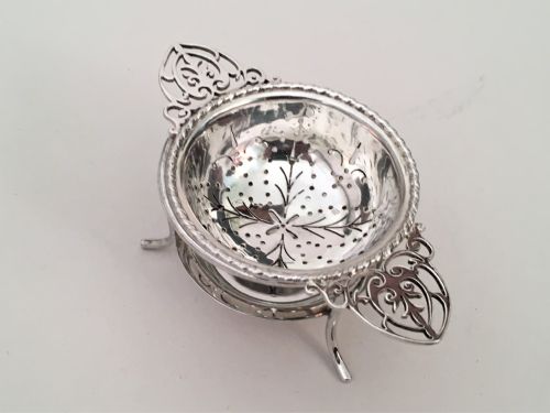 fig 1. A charming silver tea strainer & drip cup